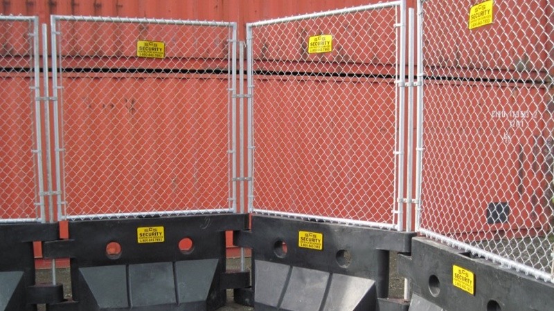 Watercade fencing in front of container